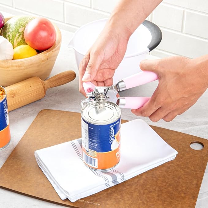 Restaurantware Comfy Grip 7.6 x 1.9 x 2.1 Inch Can Opener 1 Durable Manual Can Opener - Sharp Wheel Blade Grip Handle Pink Stainless Steel Hand-Held Can Opener Built-In Bottle Opener