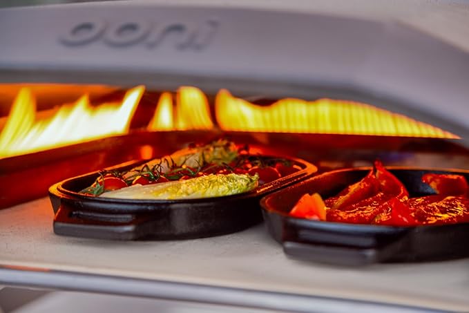 ooni Cast Iron Sizzler Pan - Griddle Frying Pan, 12" x 6" Sizzler Plate with Removable Handle and Stainless Steel Trivet, Pre-Seasoned Non-Stick Oven Safe Cookware, Pizza Oven and BBQ Accessories